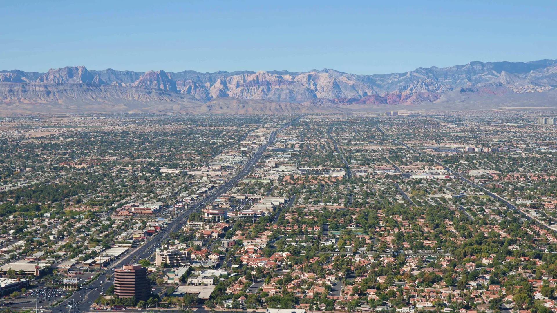 a city with mountains in the background