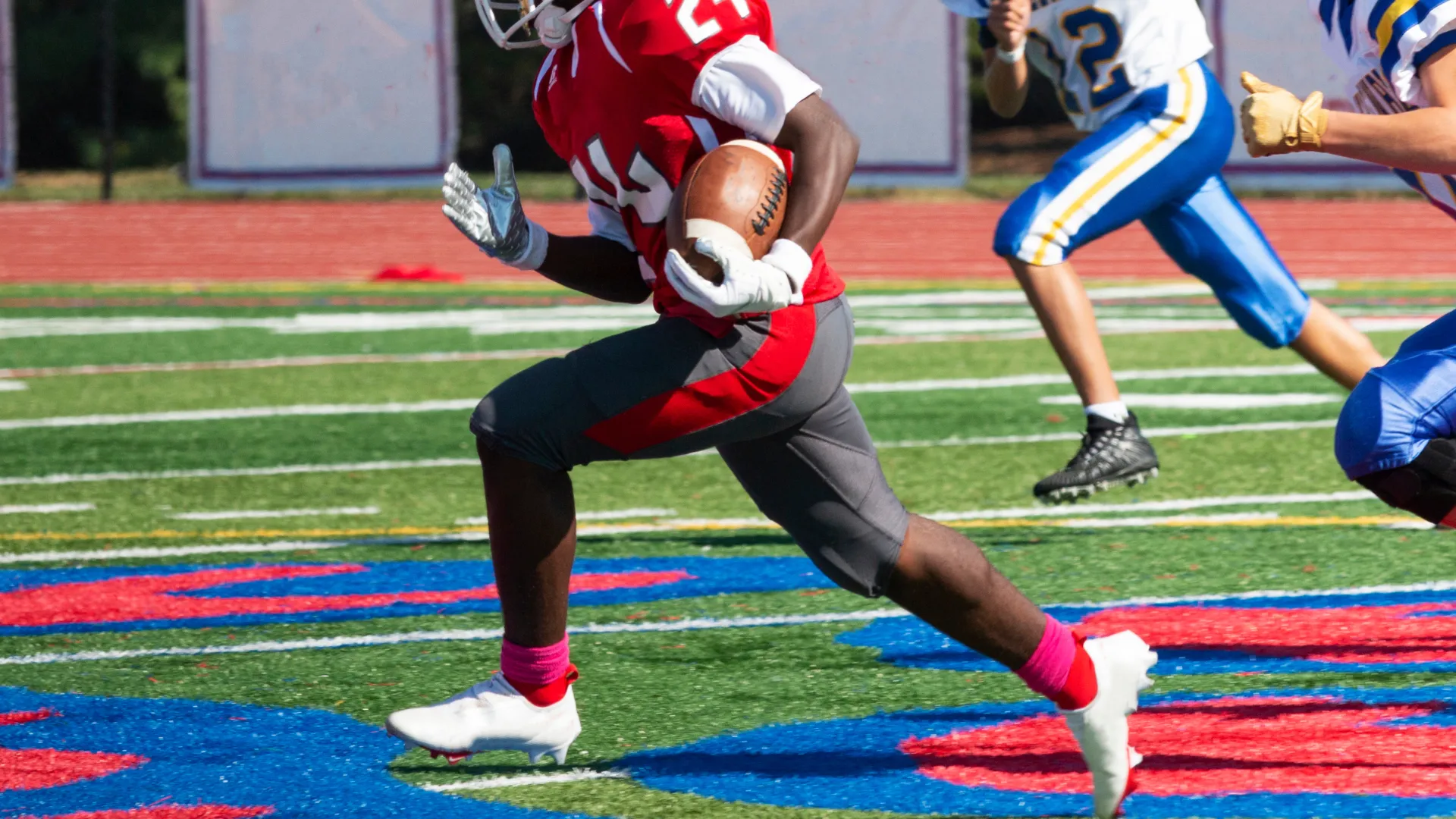 a football player in a red uniform