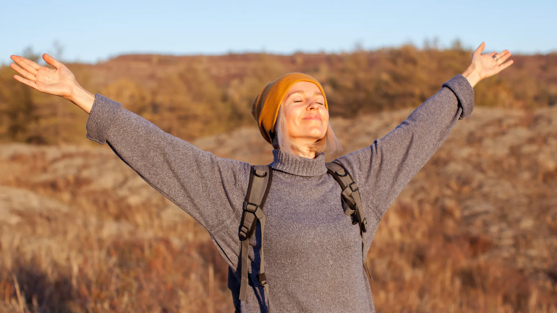 a man with his arms raised