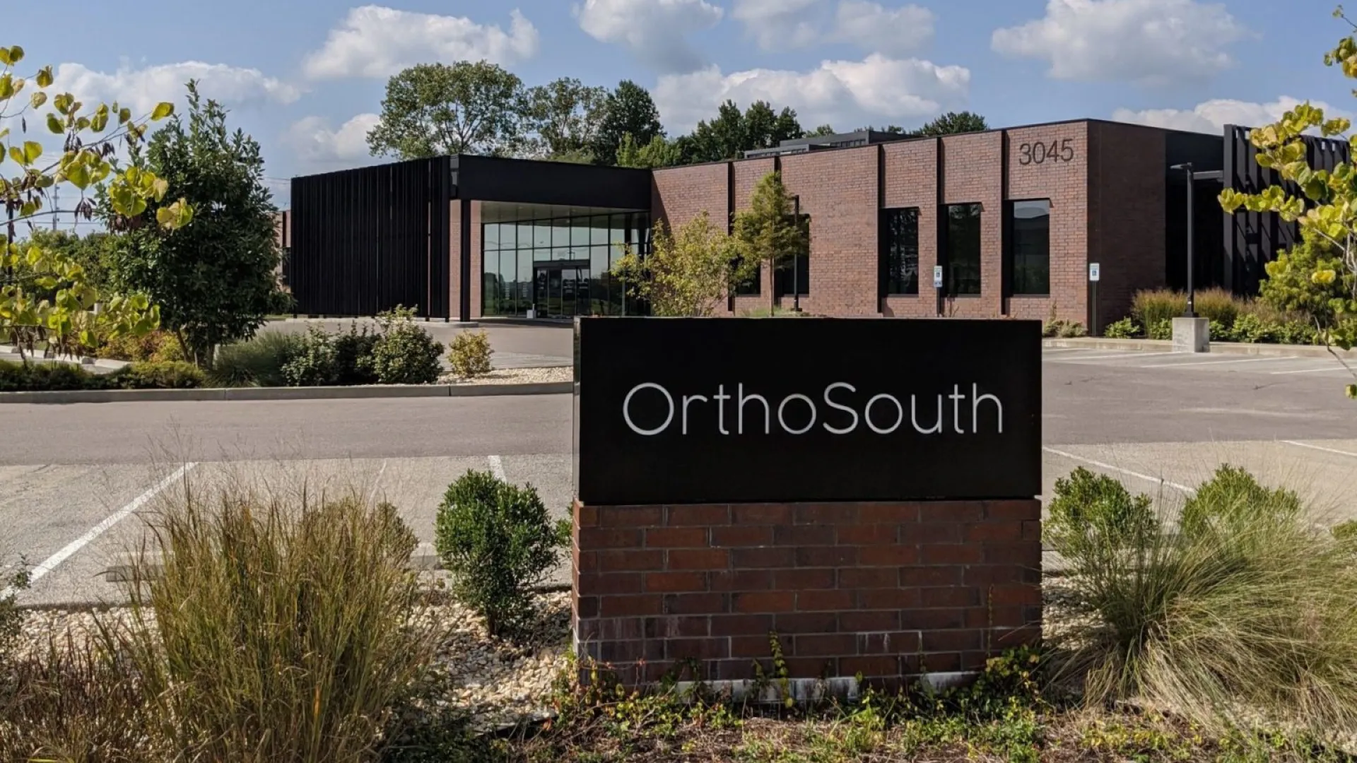 a sign in front of a building