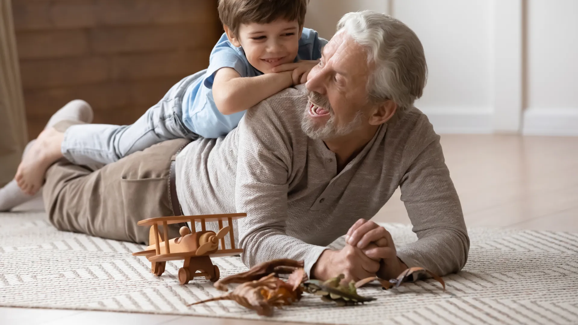 a person and a child playing with a toy