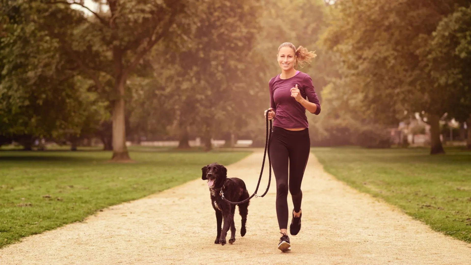 a person jogging with a dog