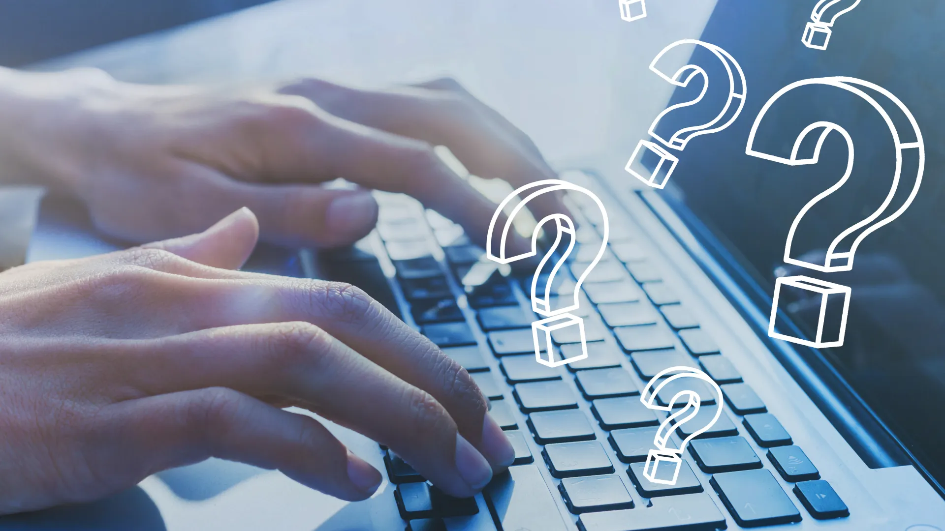 a hand on a laptop keyboard