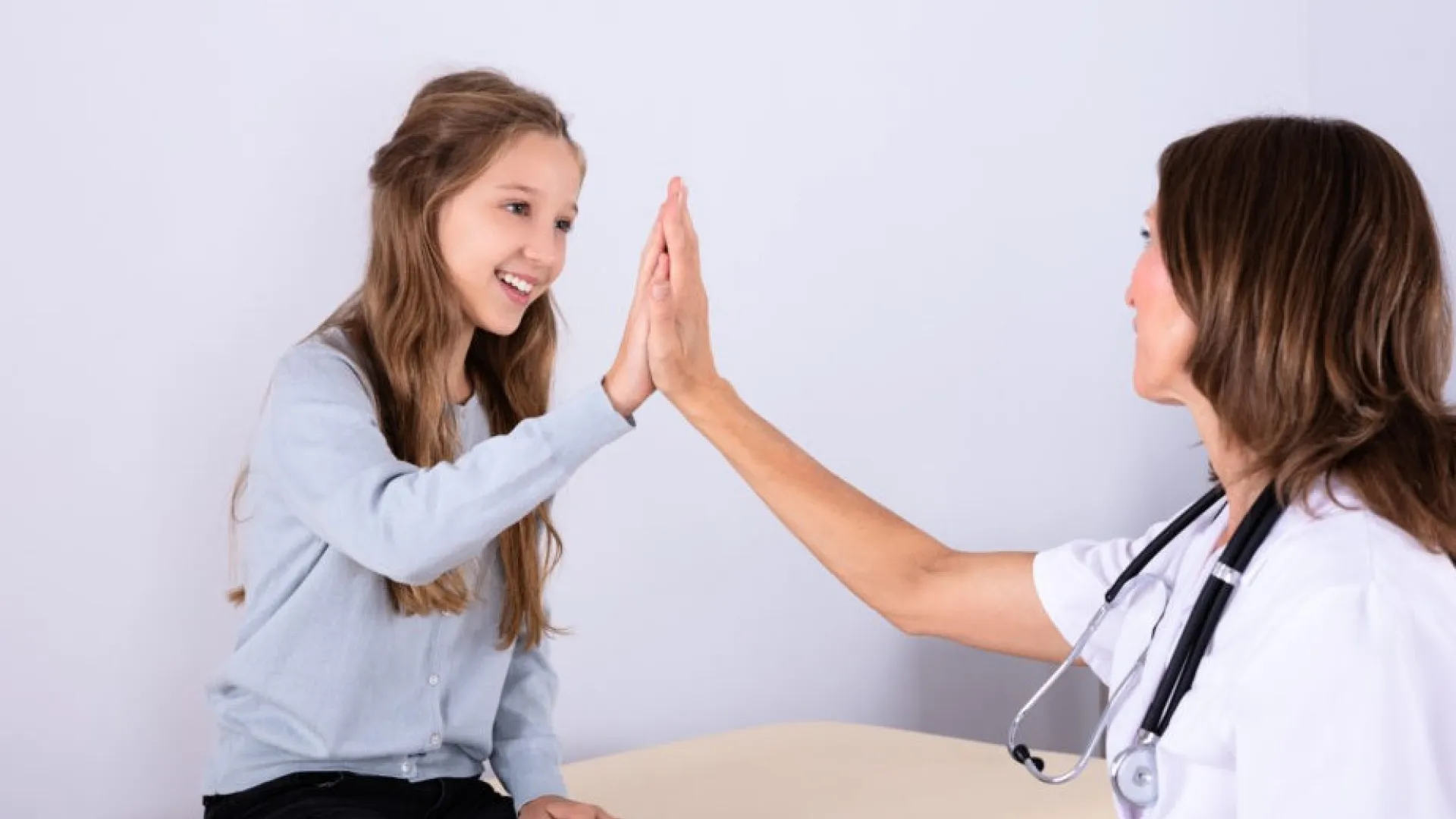 a doctor giving a patient a shot