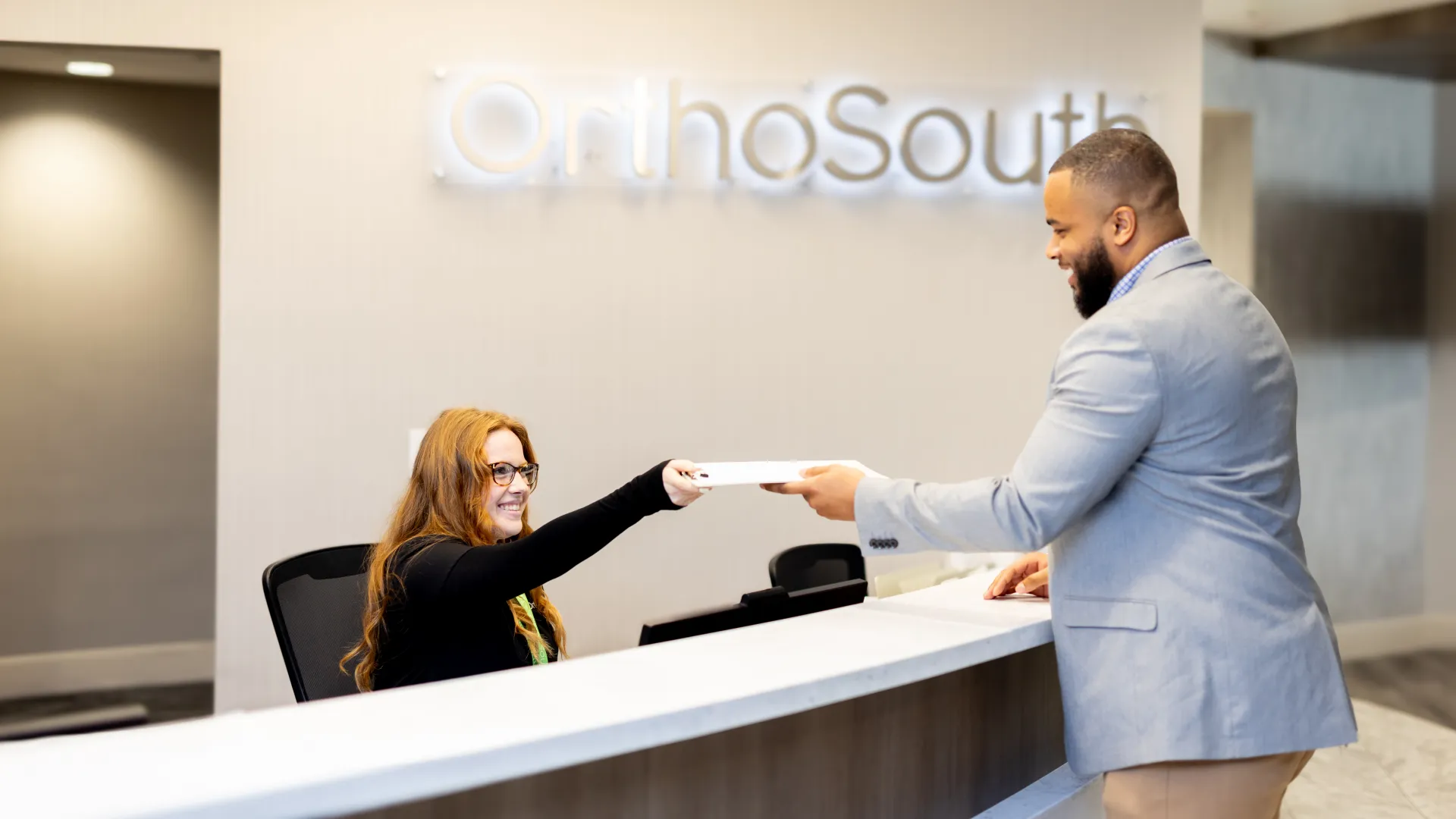 a man and a woman shaking hands