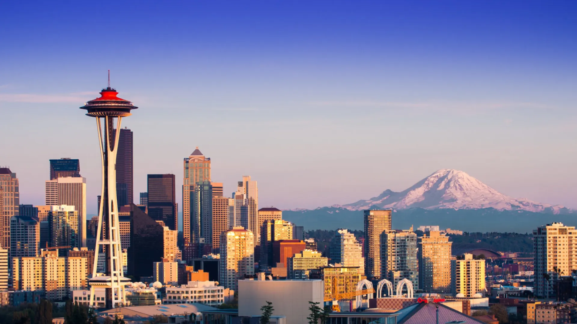 a city with a mountain in the background