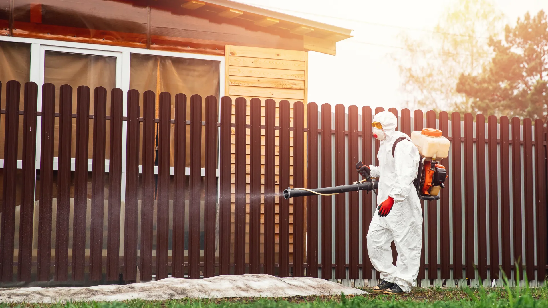 a person in a garment holding a blower