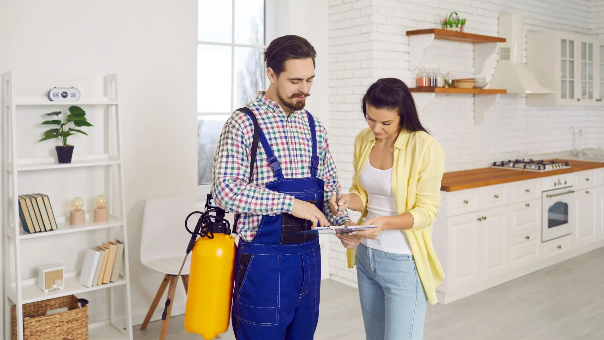 a man and a woman looking at a tablet