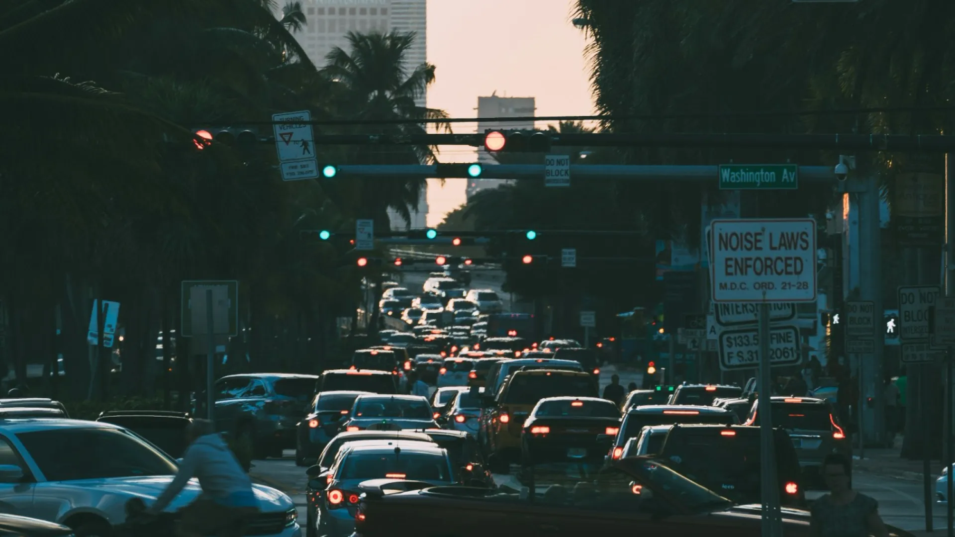 a busy street with cars and people