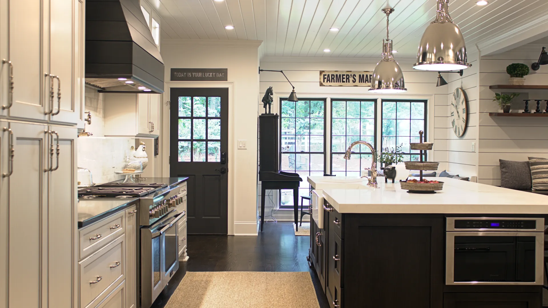 a kitchen with a shiplap hood & plank ceiling