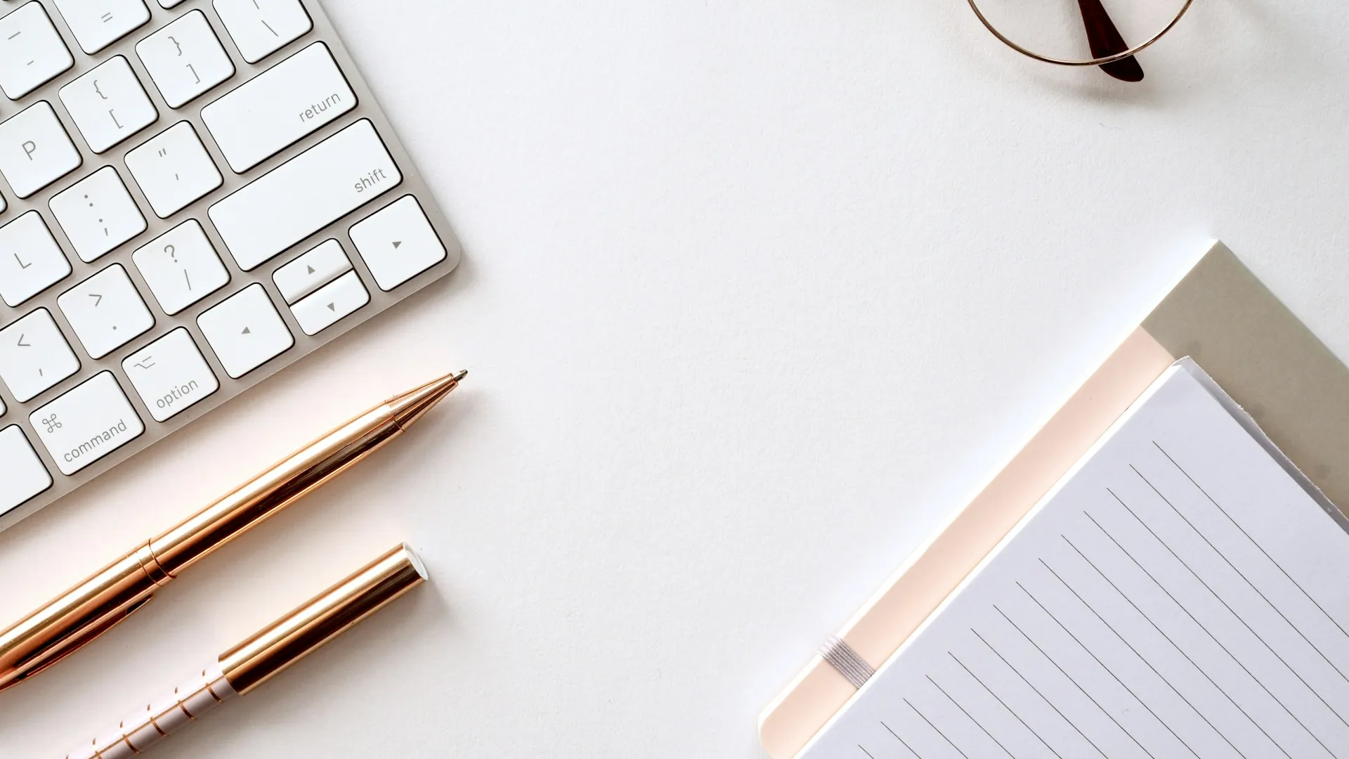 a pen and a notebook on a table