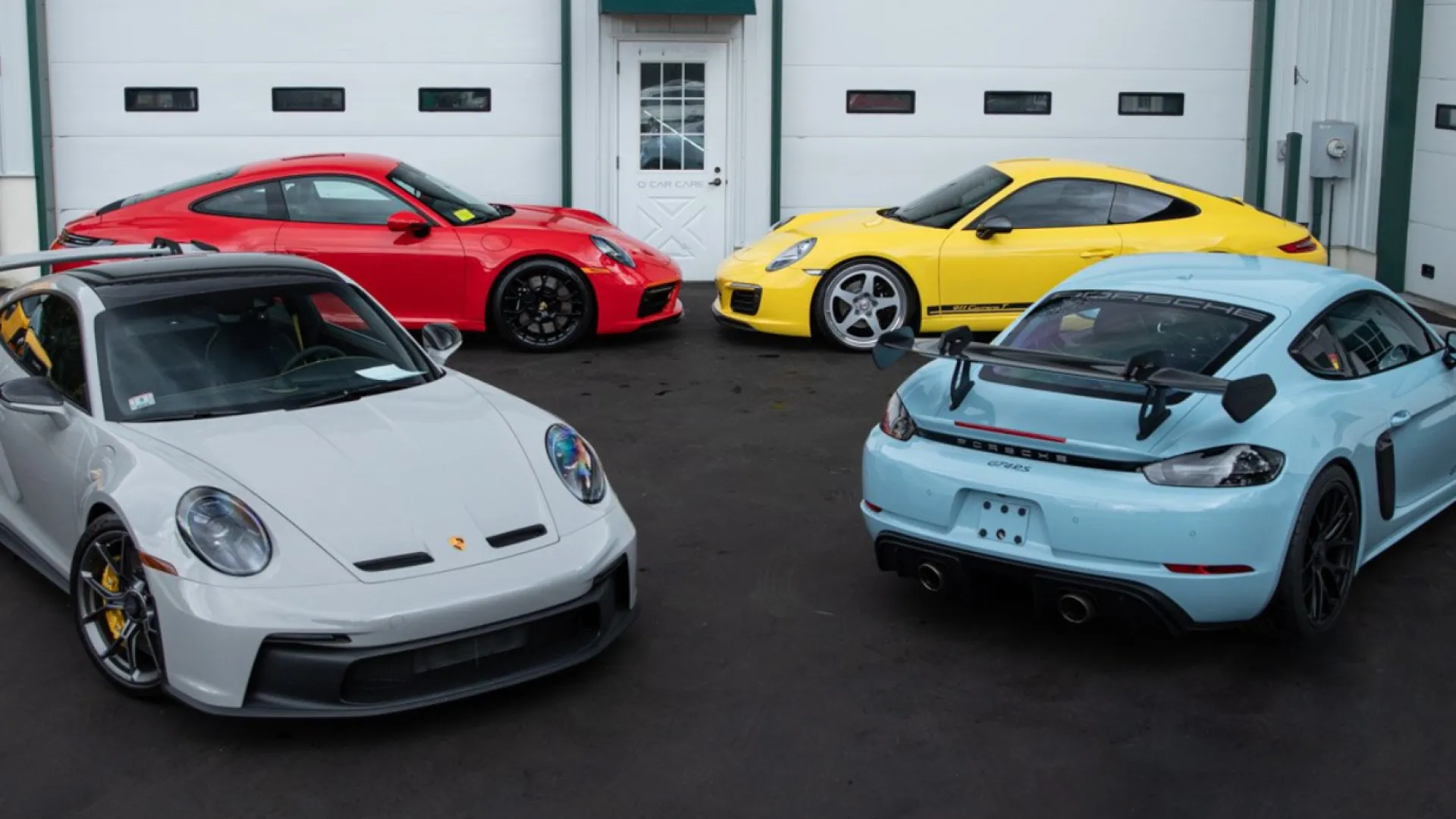 a group of cars parked in a garage