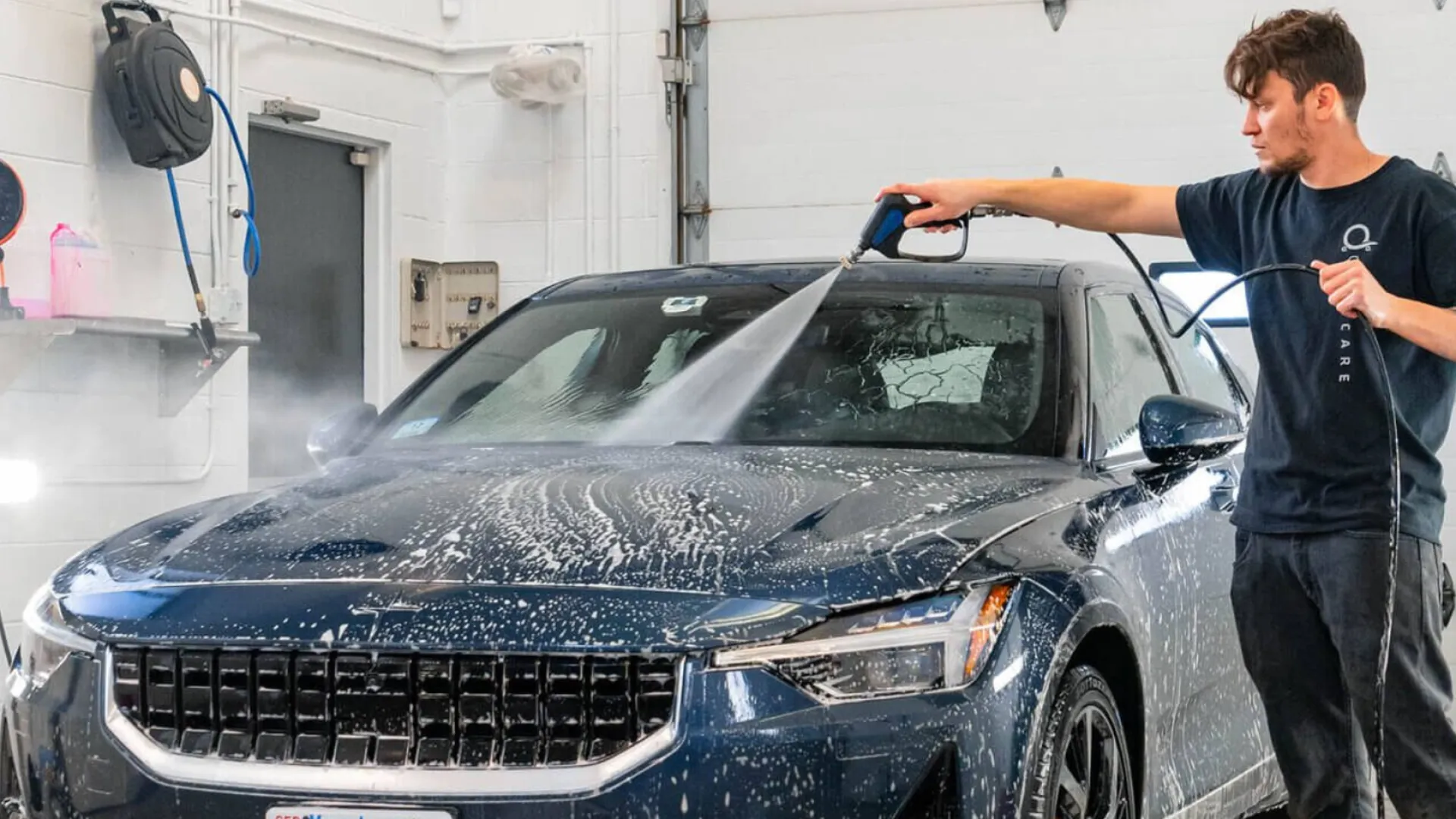 a man standing next to a car