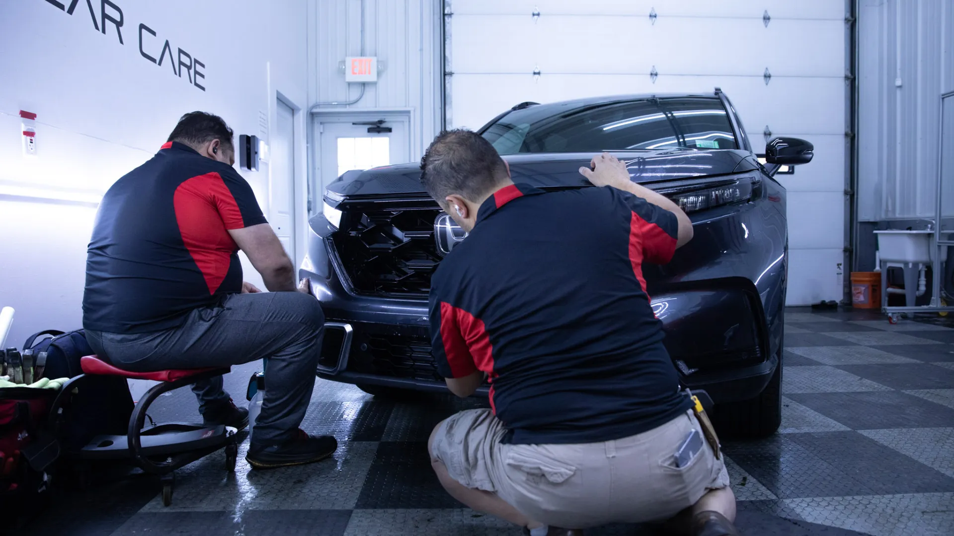 men working on a car