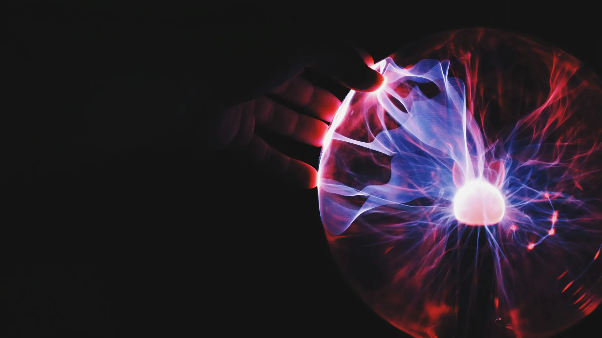 a hand holding a glowing orb