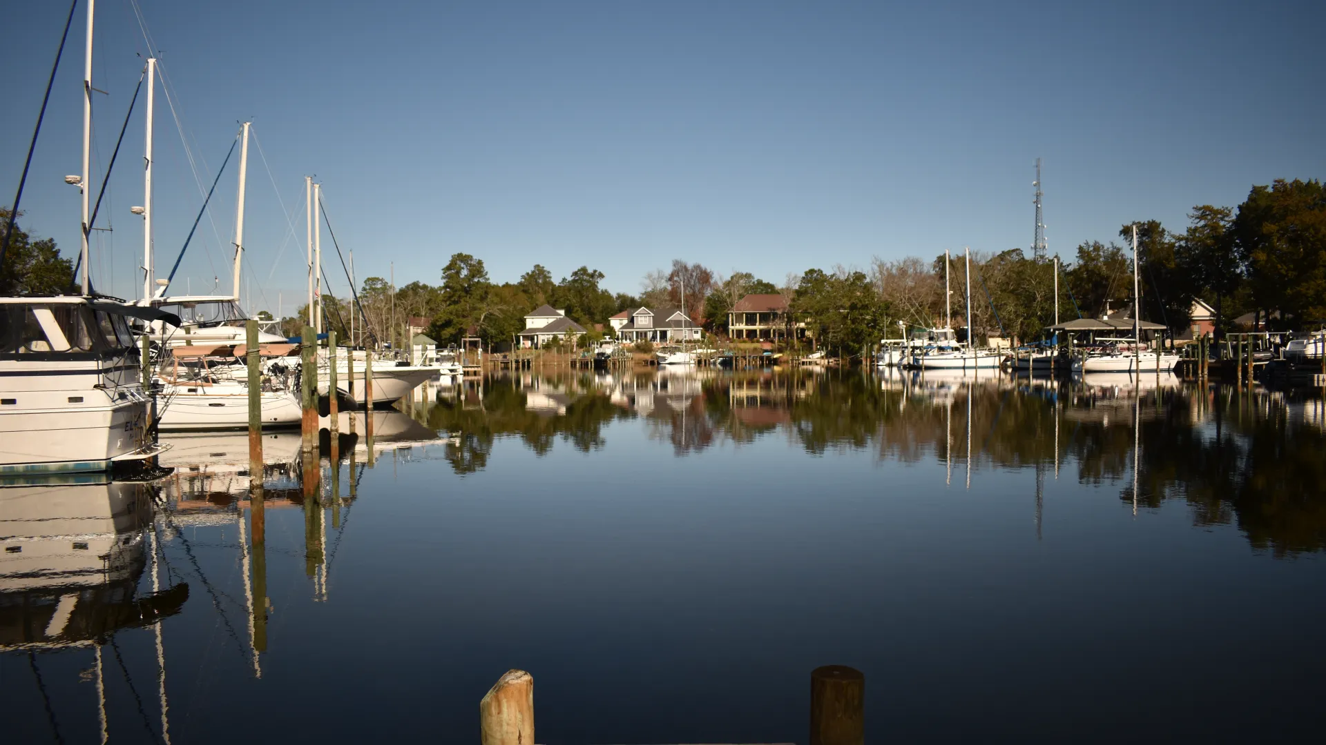 a dock with boats in a harbor