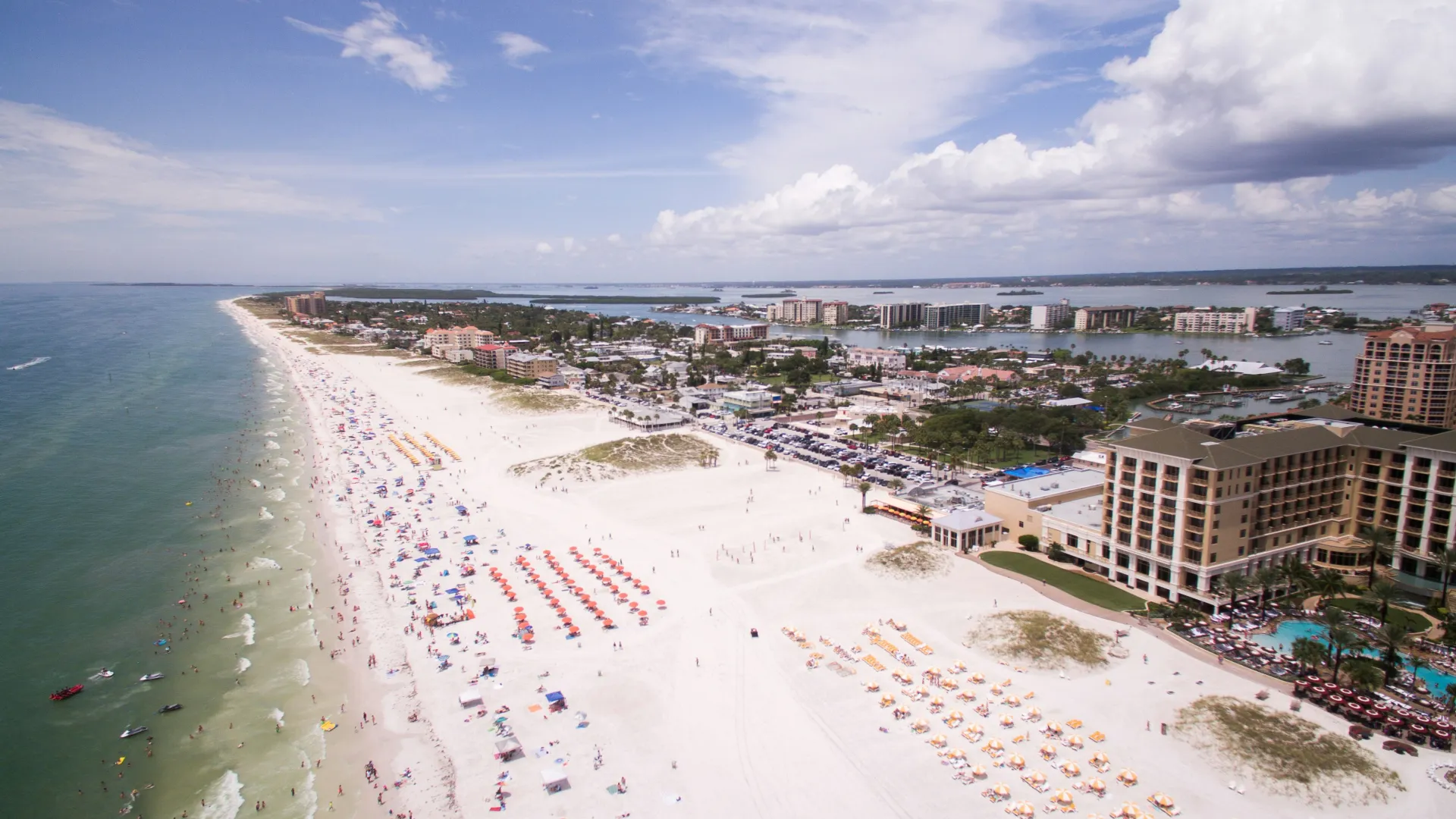 a beach with many people on it