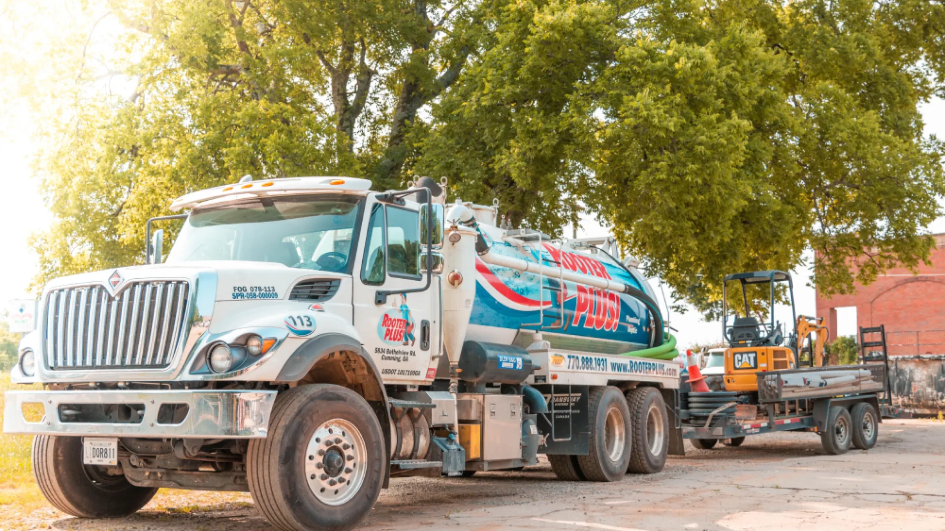 a large truck is parked next to a construction vehicle