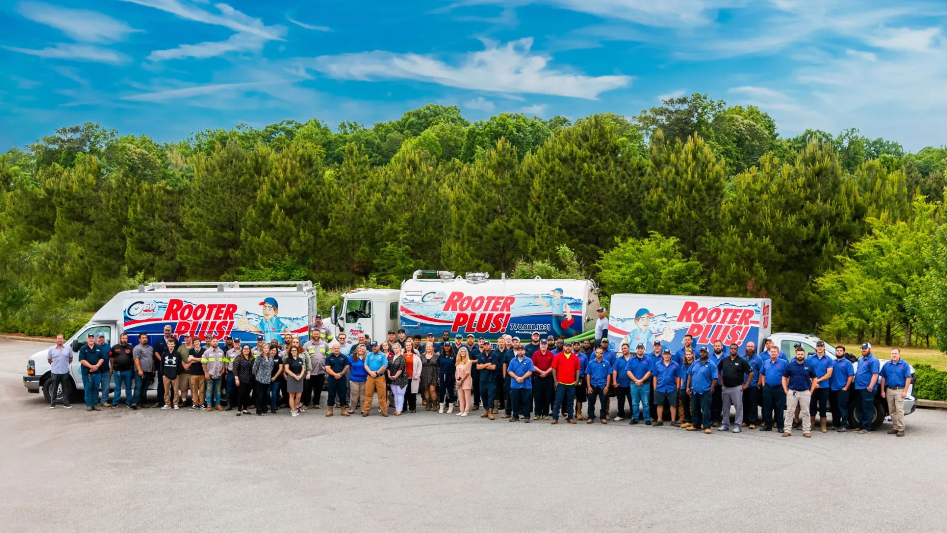 a group of people standing in front of a line of food trucks