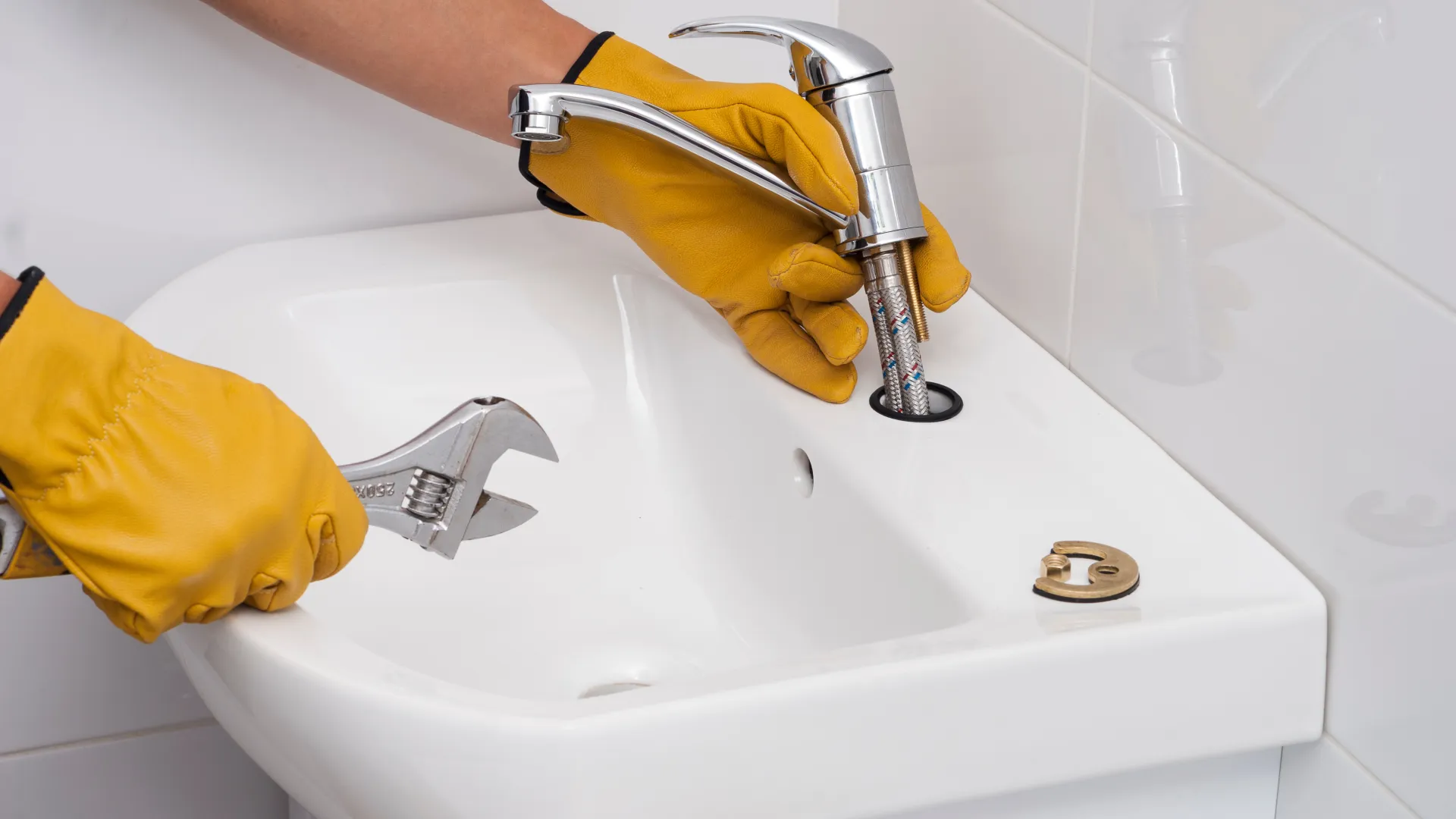 a plumber washing a sink in atlanta