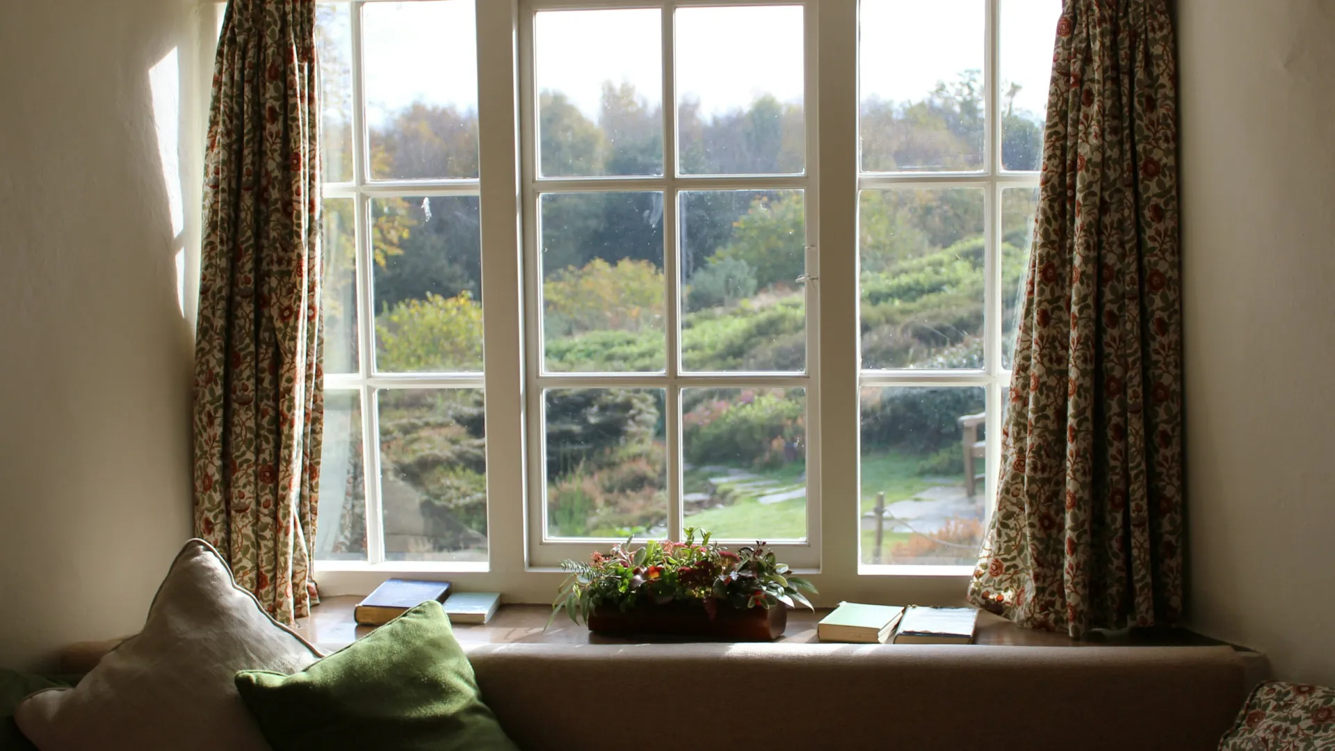 a couch with a window and pillows