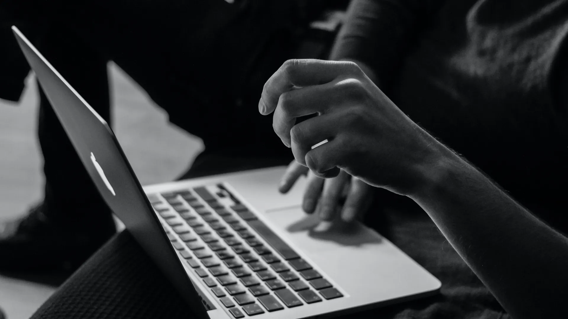 a person typing on a laptop