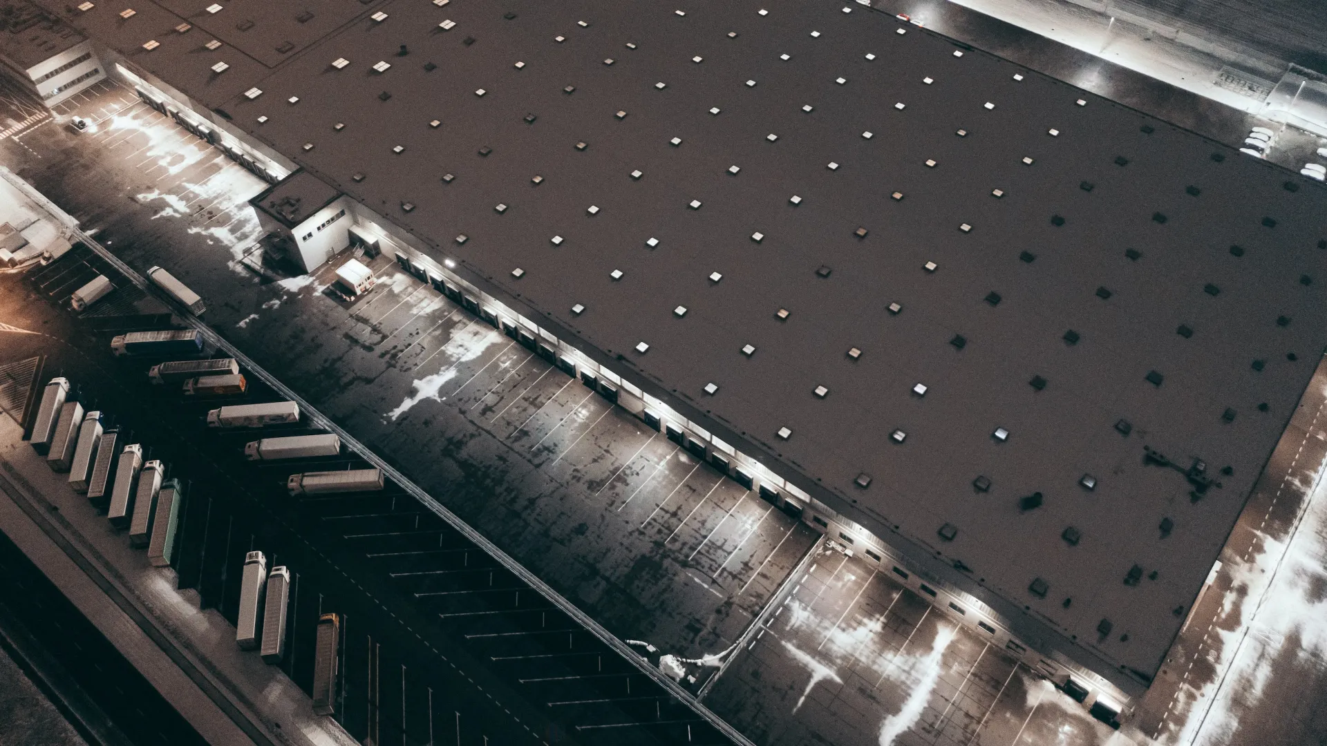 a train station with a large glass ceiling