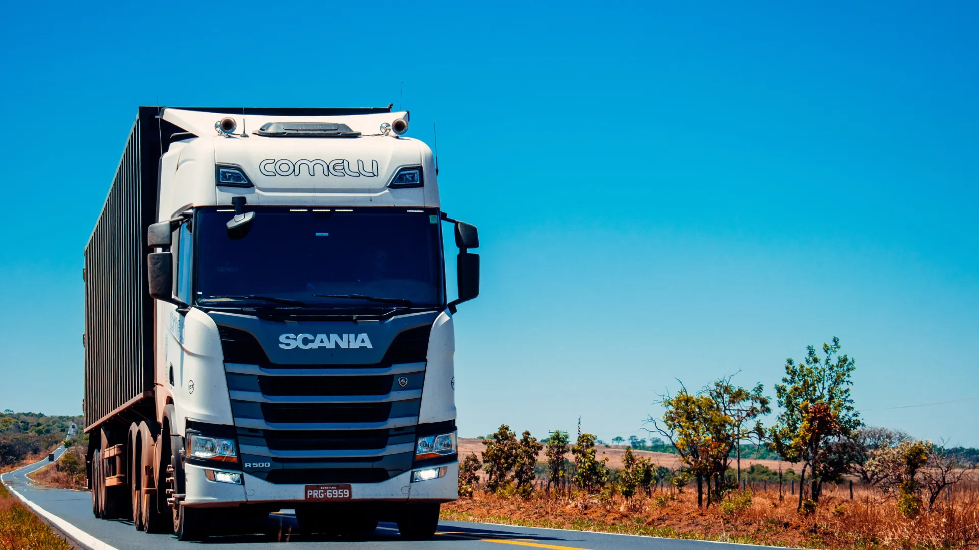 a large truck drives down the road