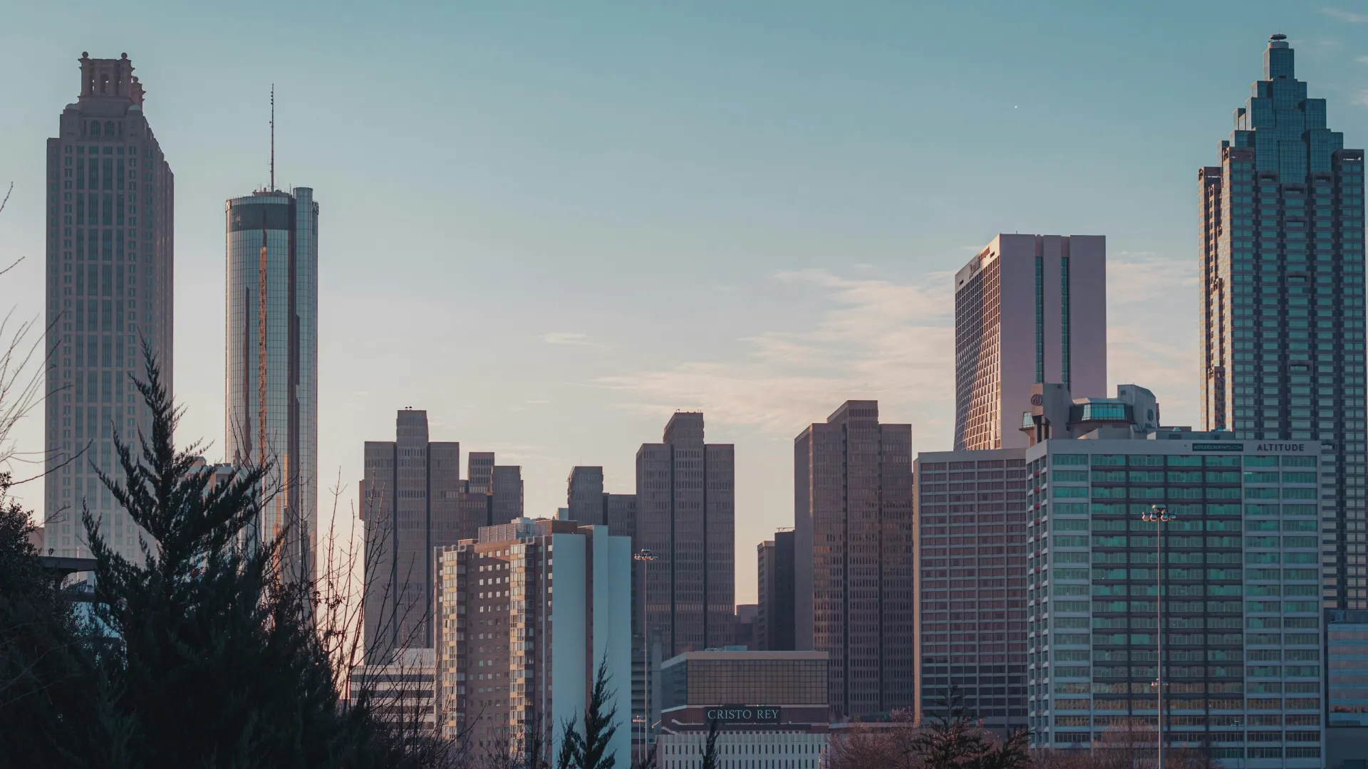 a city skyline with tall buildings