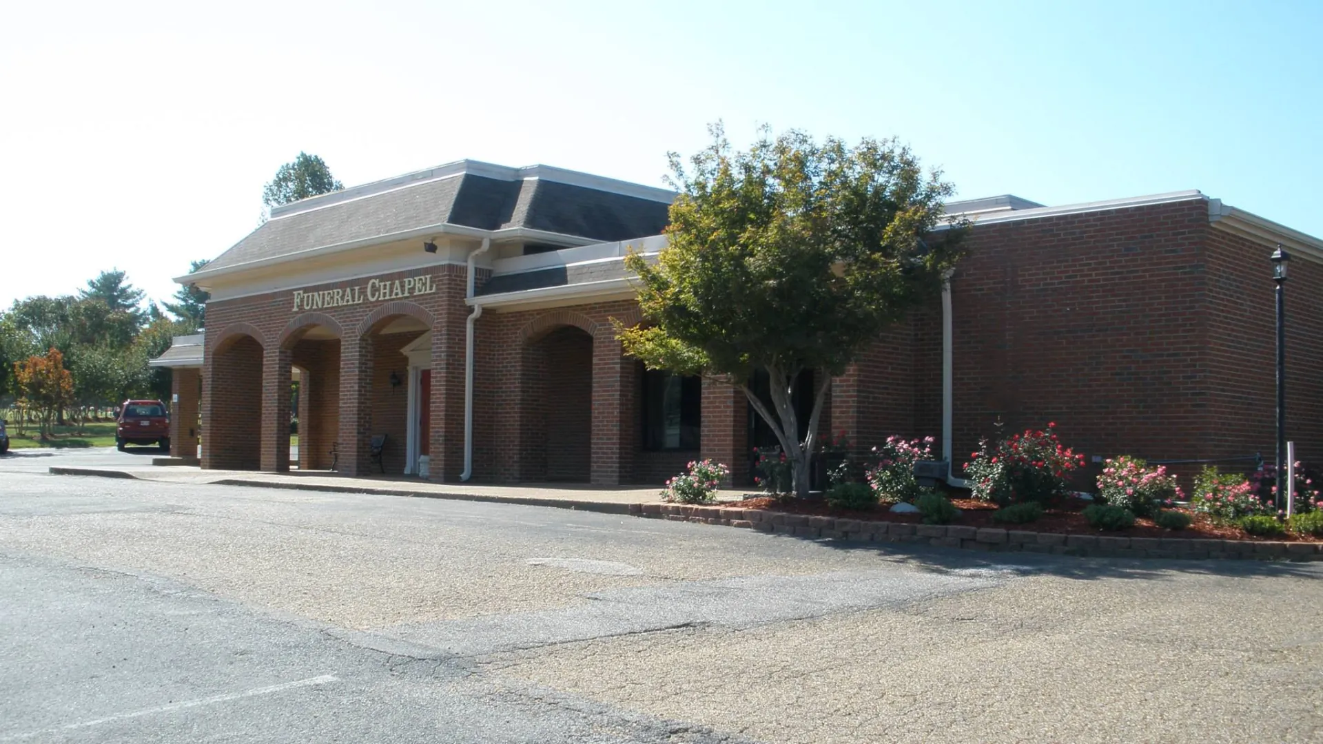 a building with a store on the side of a road