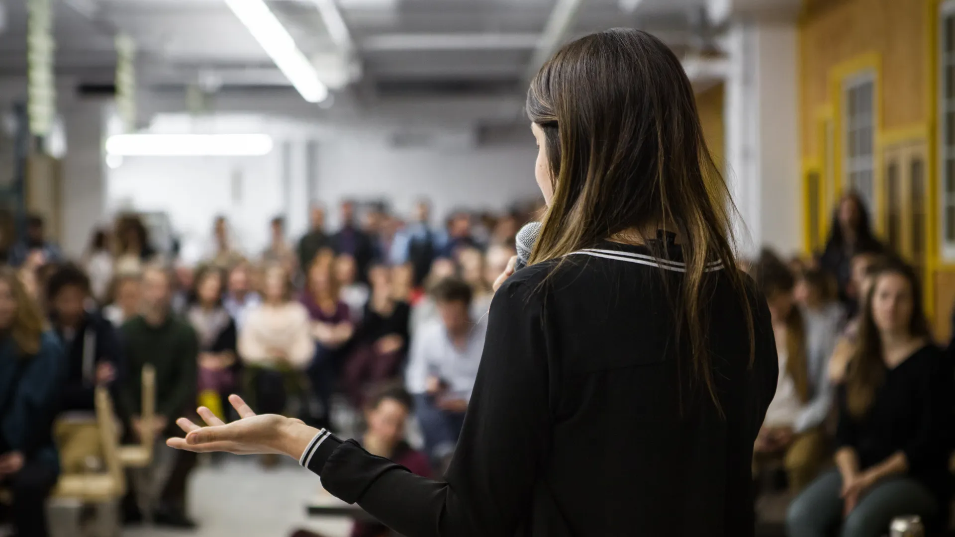 a person standing in front of a crowd