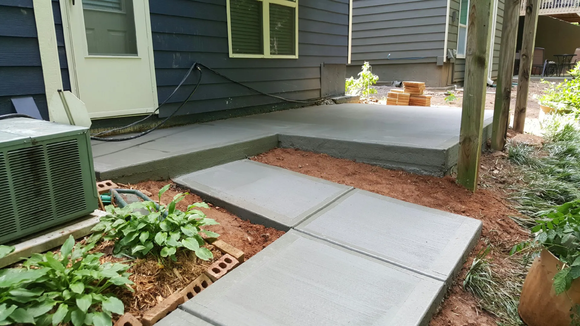 a small backyard with a small patio