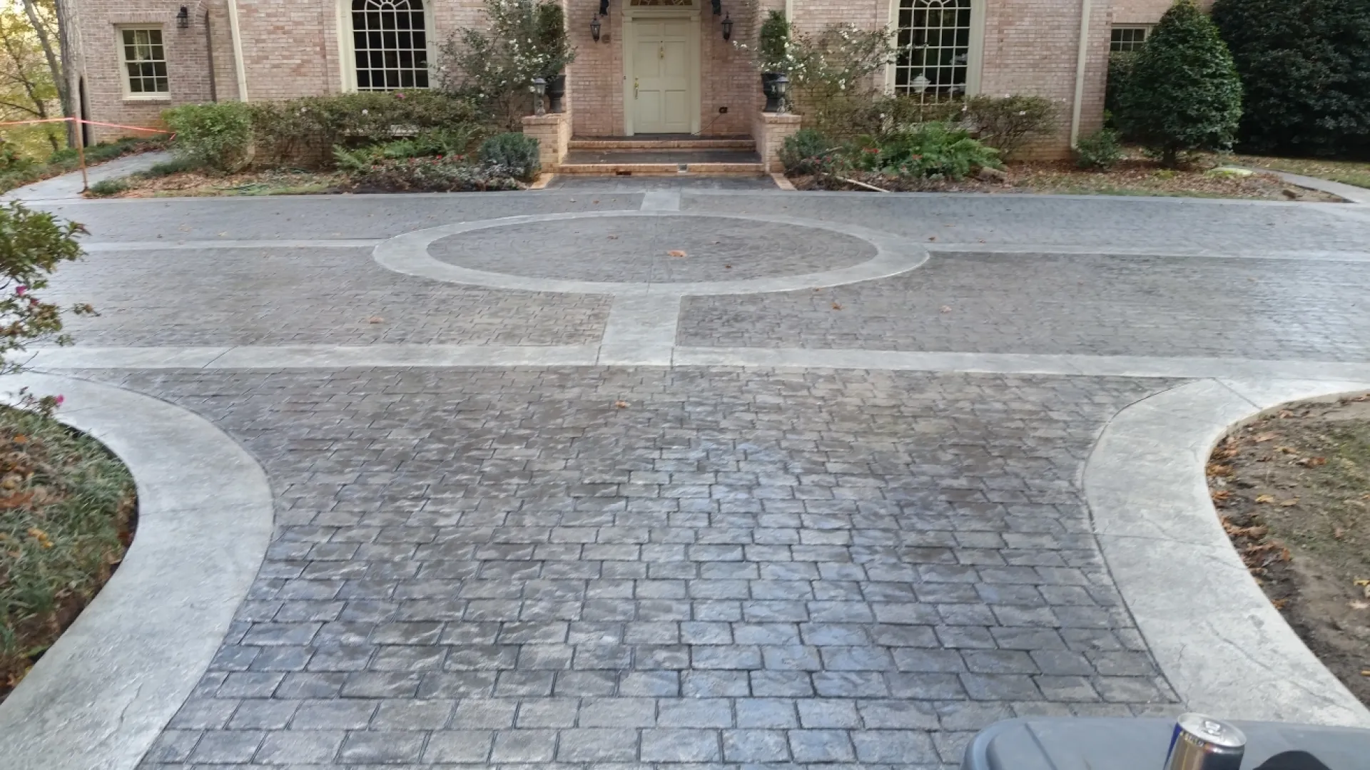 a paved area with a building in the background