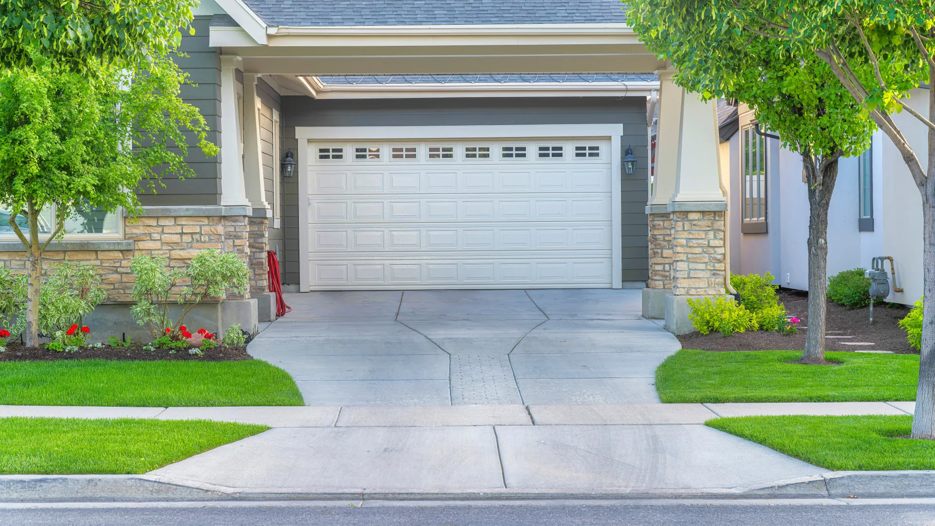 a garage with trees and grass