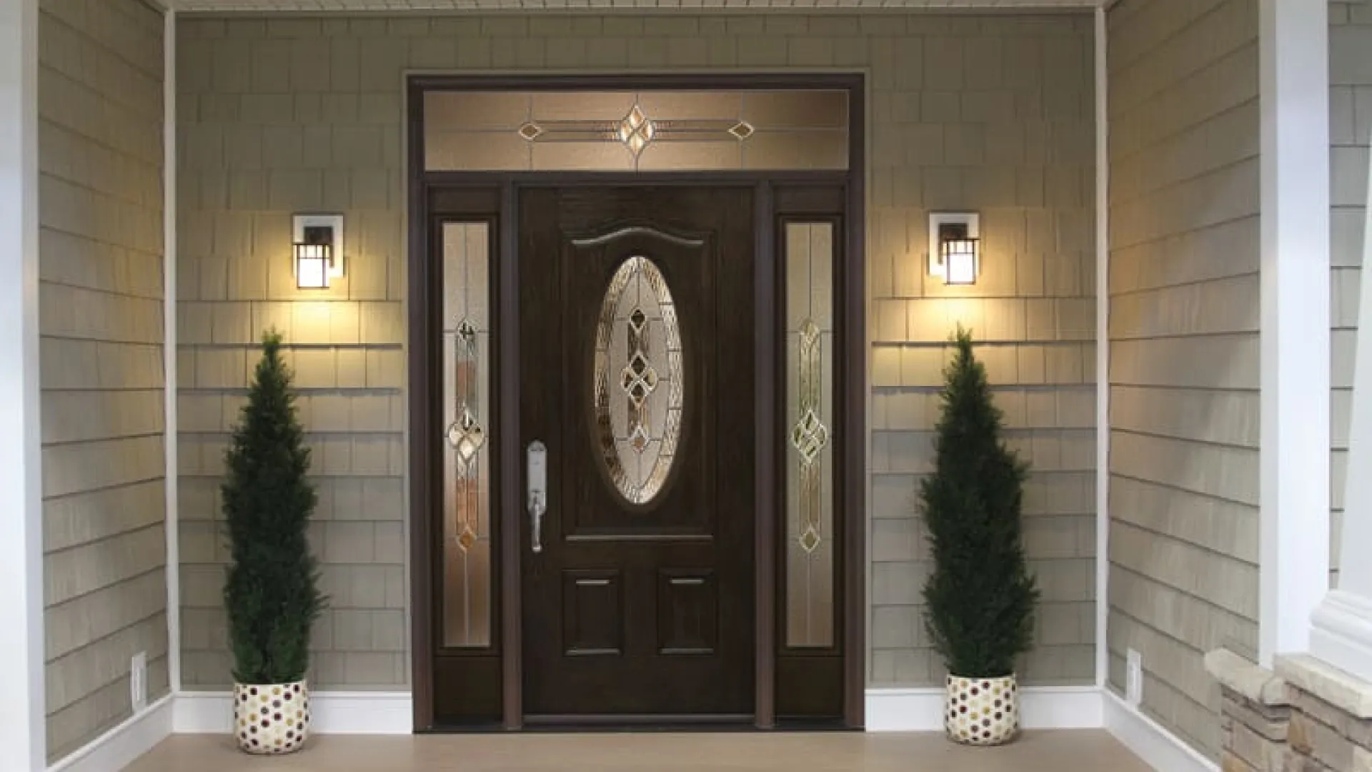 a large wooden door with a gold design on it