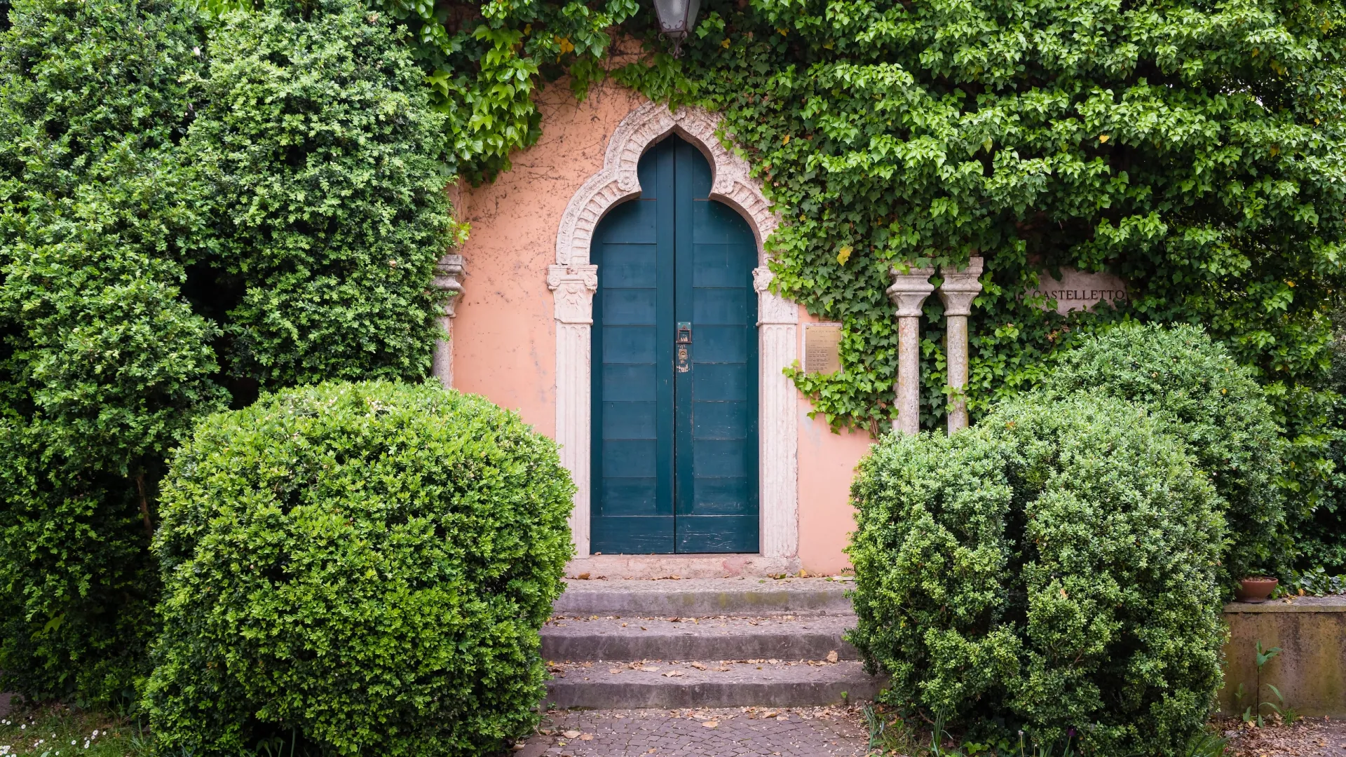 a blue door in a brick building