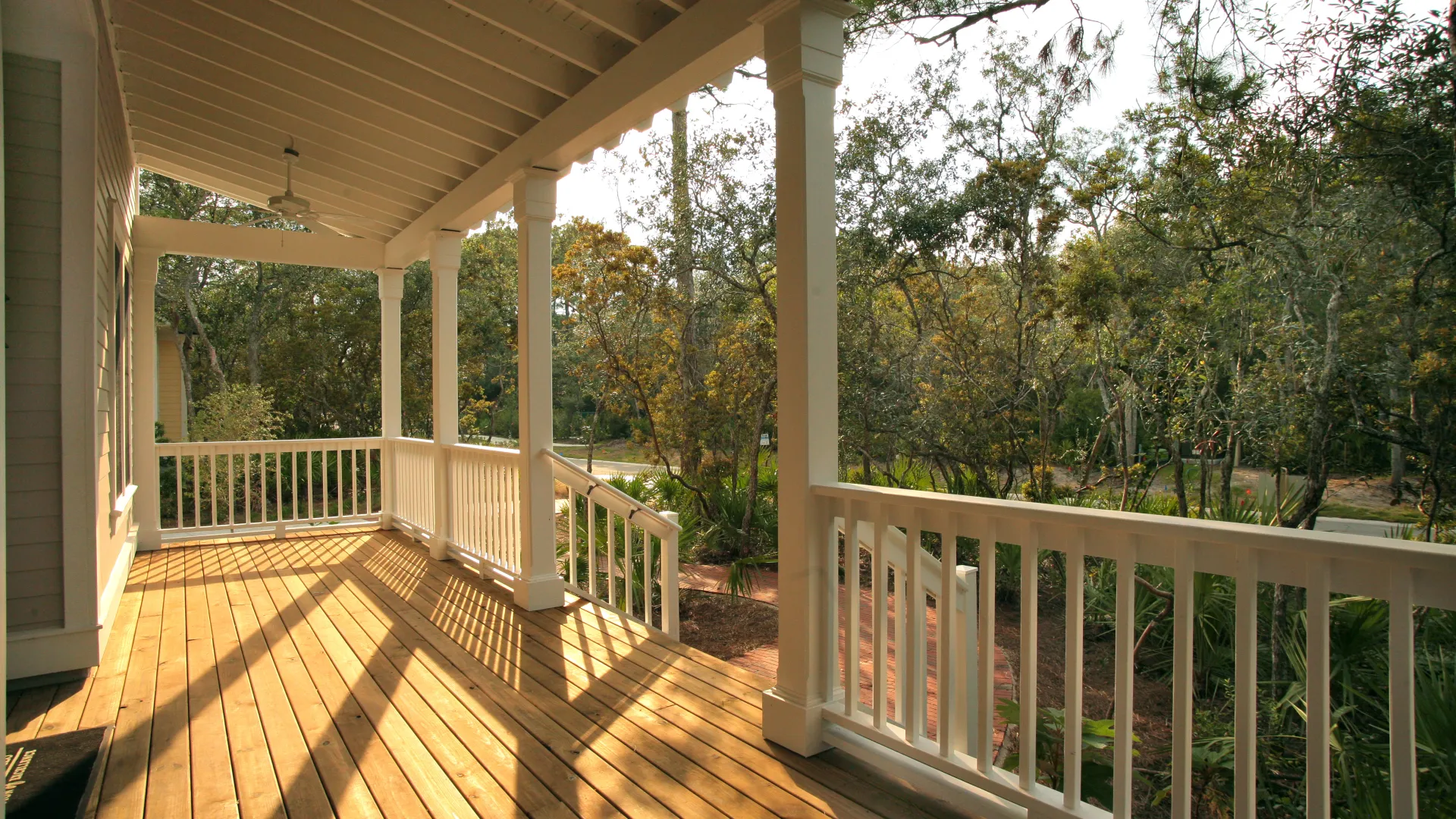 a wooden porch with a railing