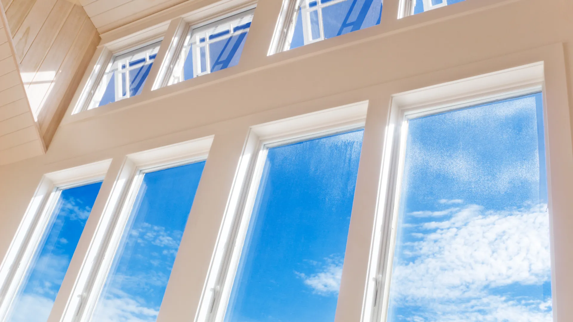 a window with blue sky and clouds