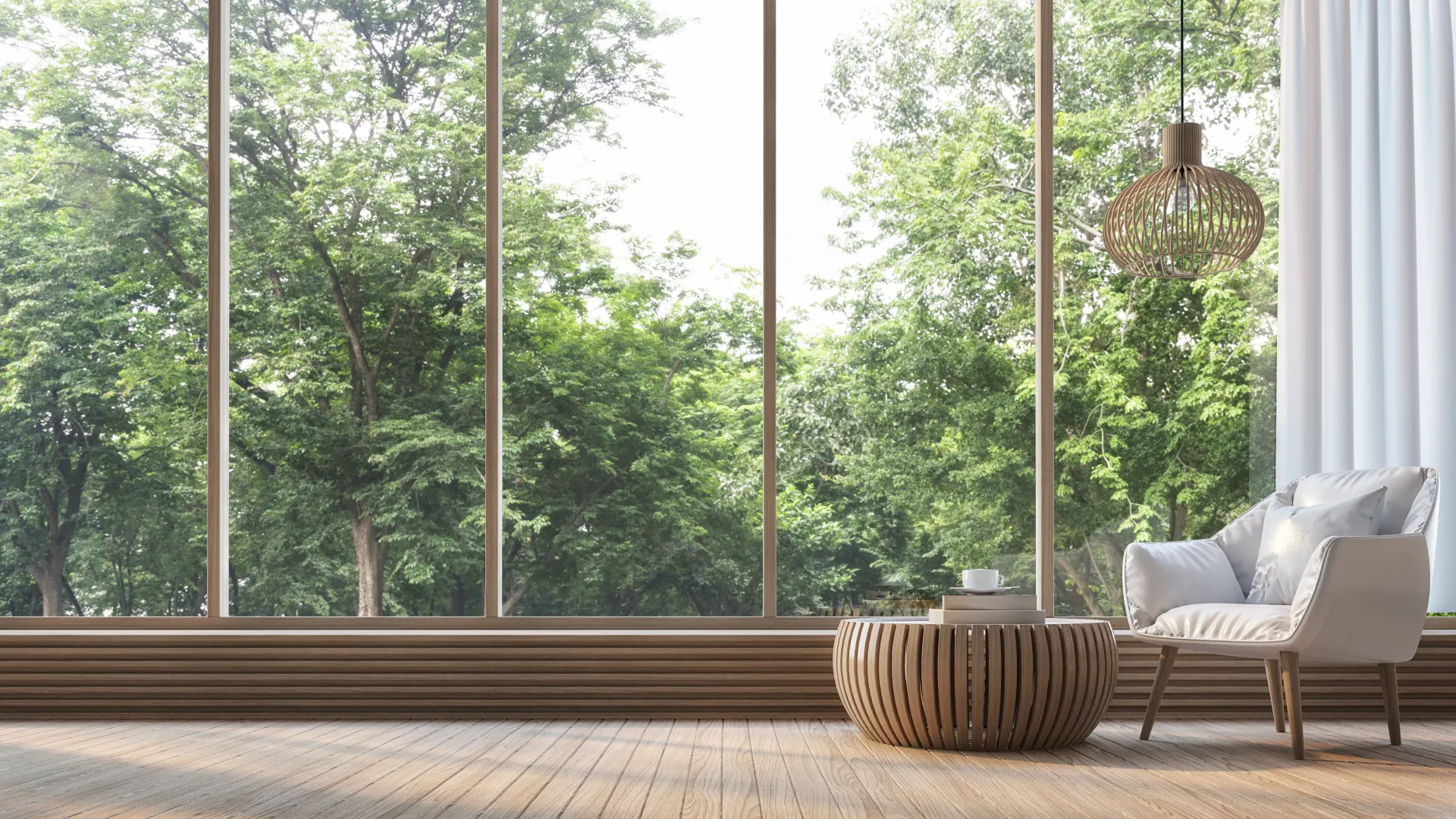 a room with a wood floor and a couch and a window with trees