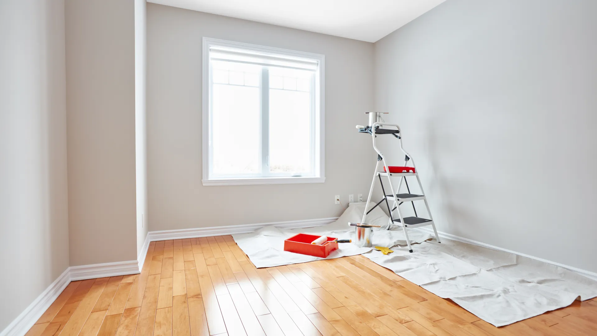 a room with a ladder and a window