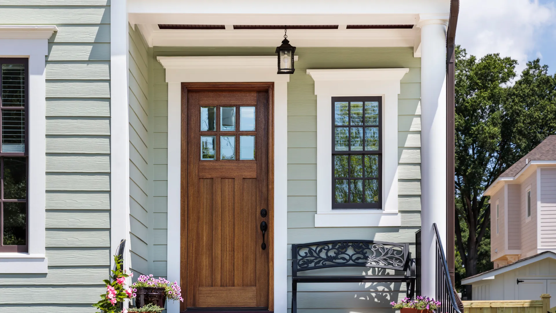 a house with a bench and a door