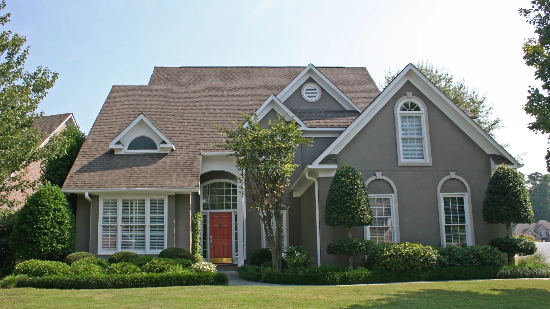 a large house with a lawn in front of it