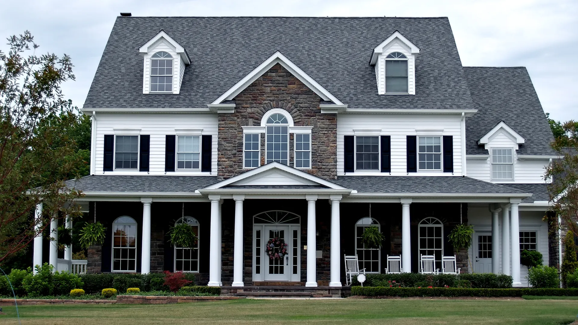 a large house with a lawn in front of it