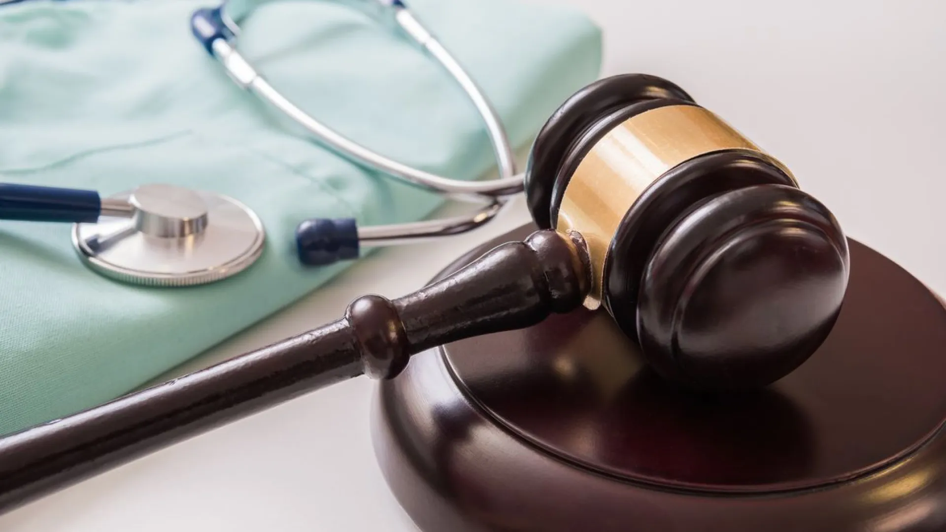 a gavel next to a stethoscope