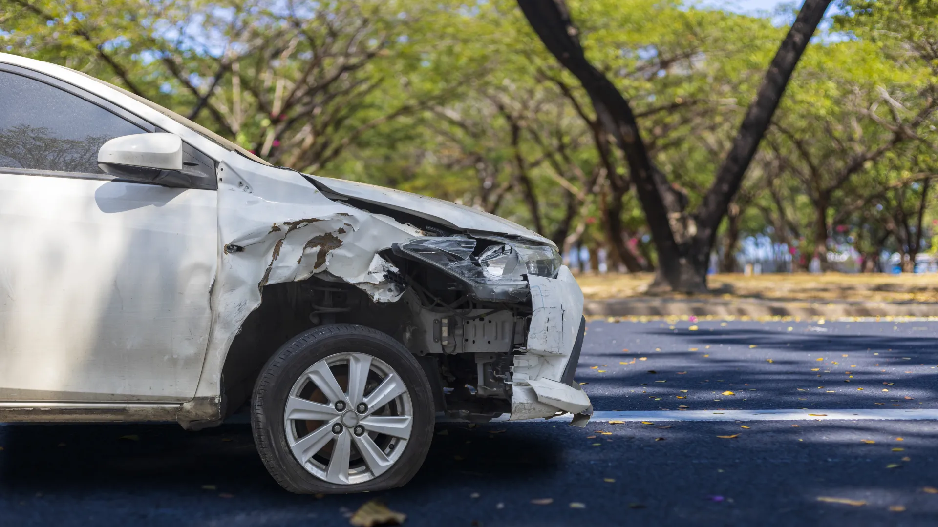 a white car damaged by a collision