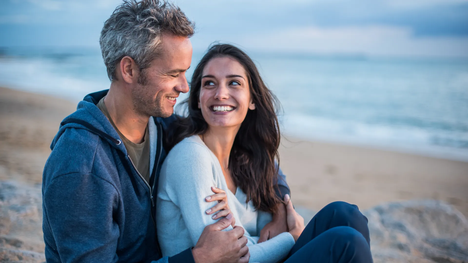 a man and a woman in a blue shirt