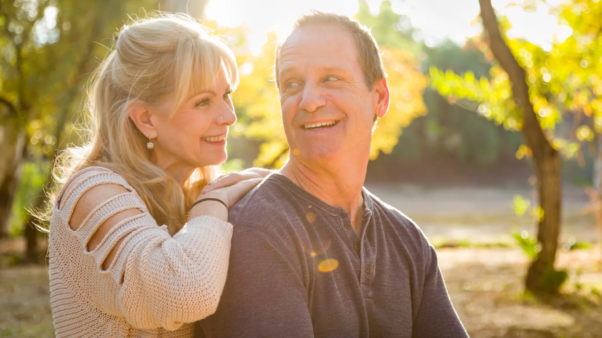 a man and woman smiling