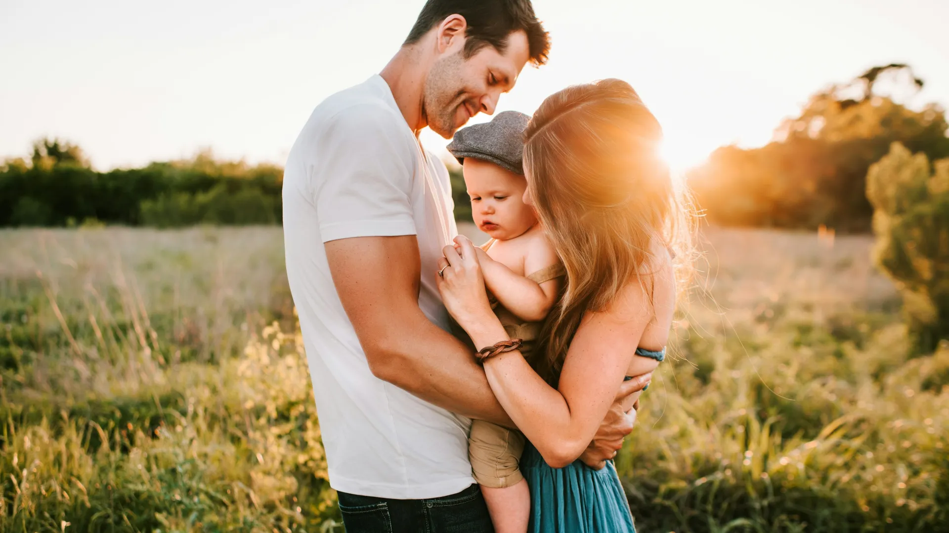 a man and woman with a baby