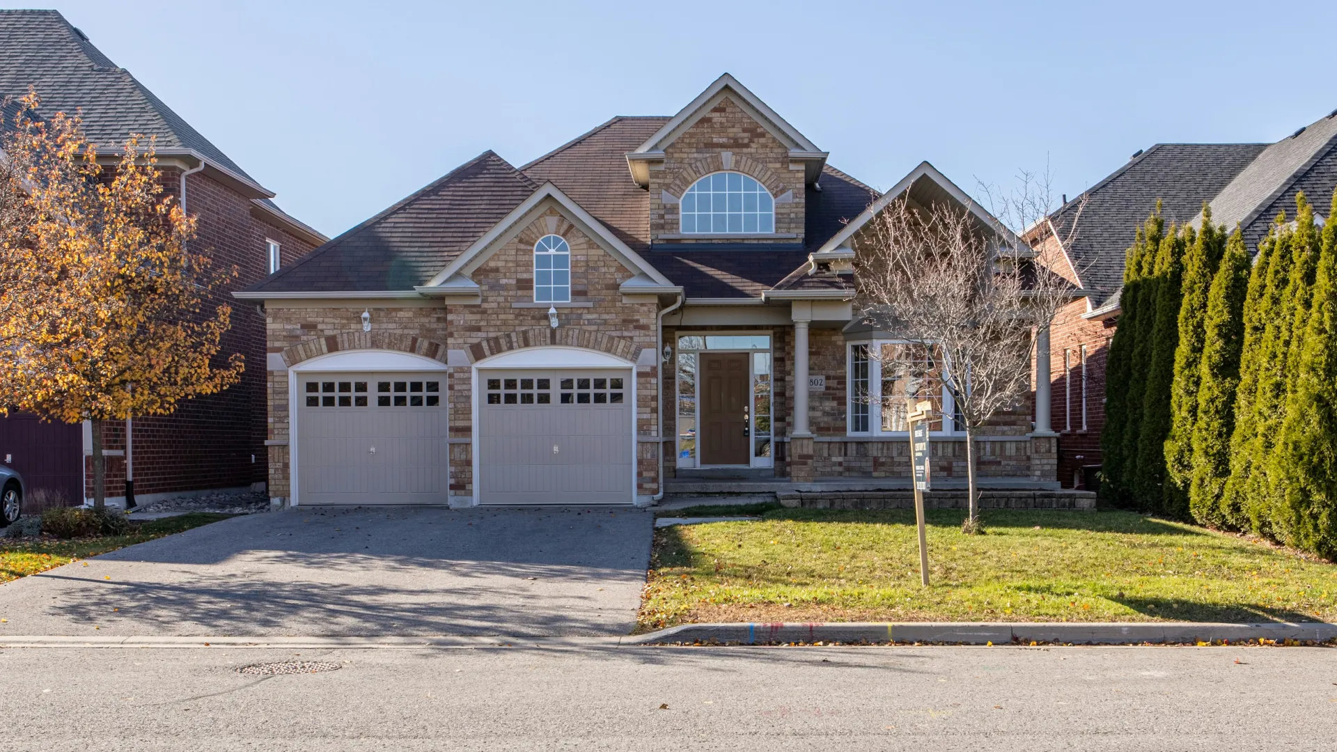 a large brick house with garages