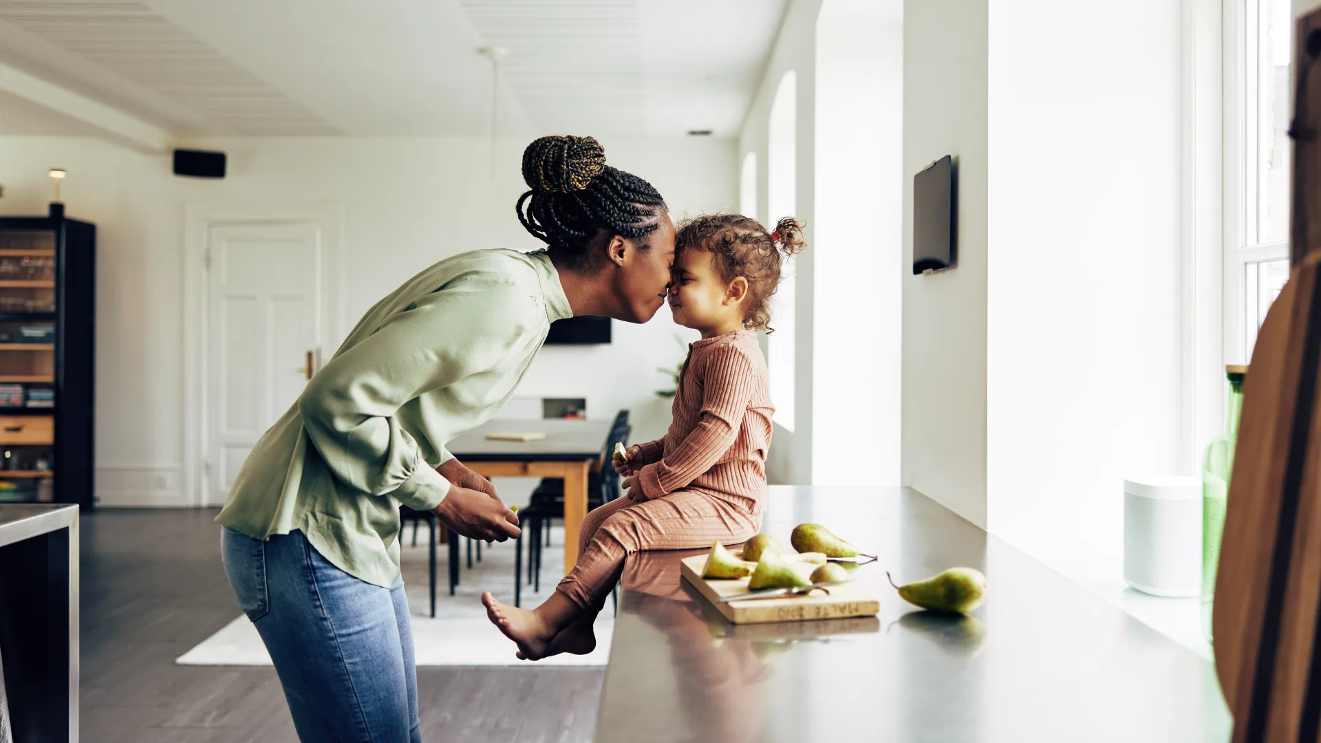 a mother and her child in the kitchen